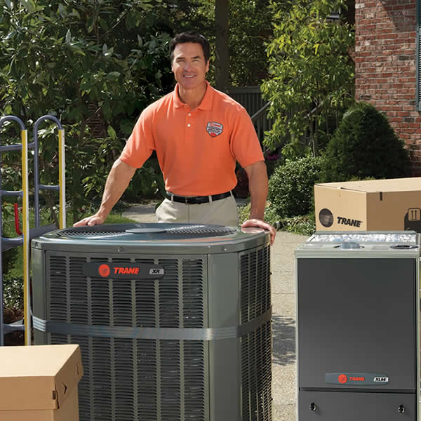 Trane Dealer With Products Around Him Trane Dealer With Products Around Him